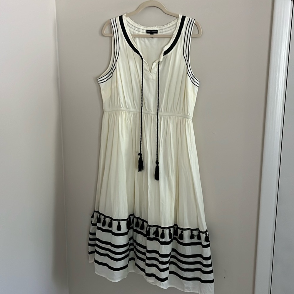 Cream and black dress with tassel details